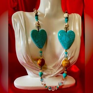Blue heart and skull necklace mixed media